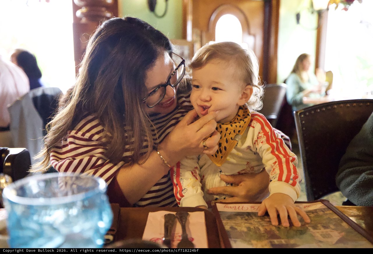Mother and Child Sharing a Sweet Moment at Restaurant