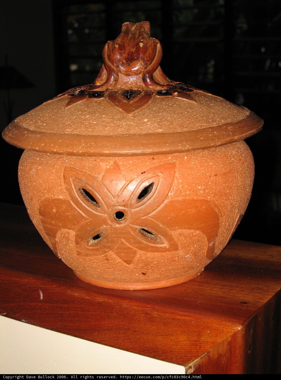Rustic Pottery on Wooden Shelf
