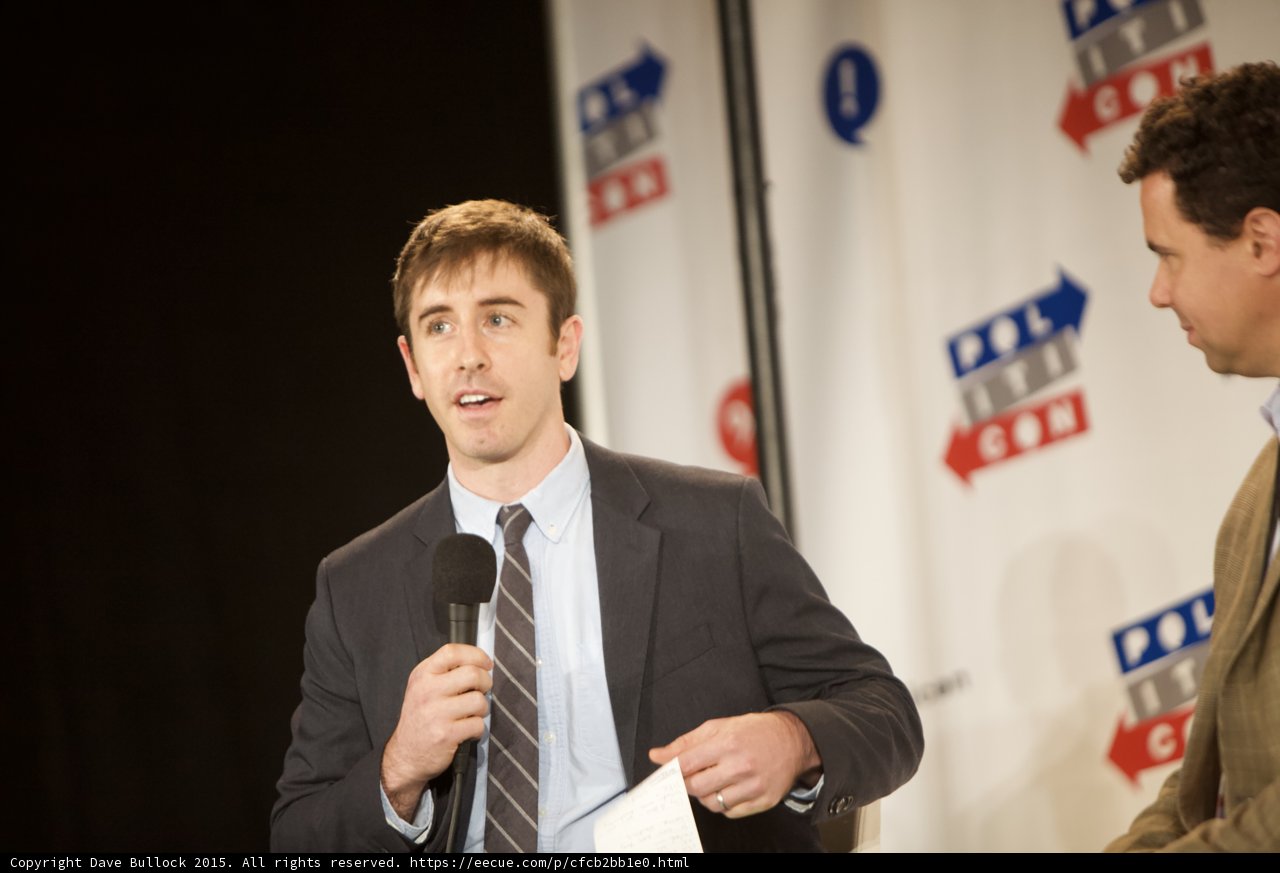 Press Conference with Two Men Holding Microphones