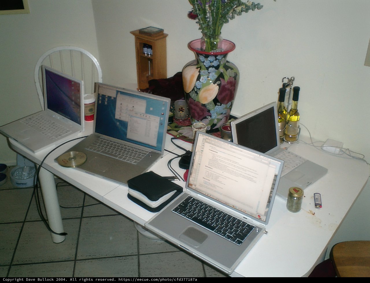 The Apple Laptops on the White Table