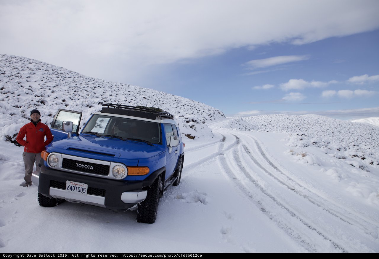 Blue Toyota FJ Cruiser on Snowy Mountain Road