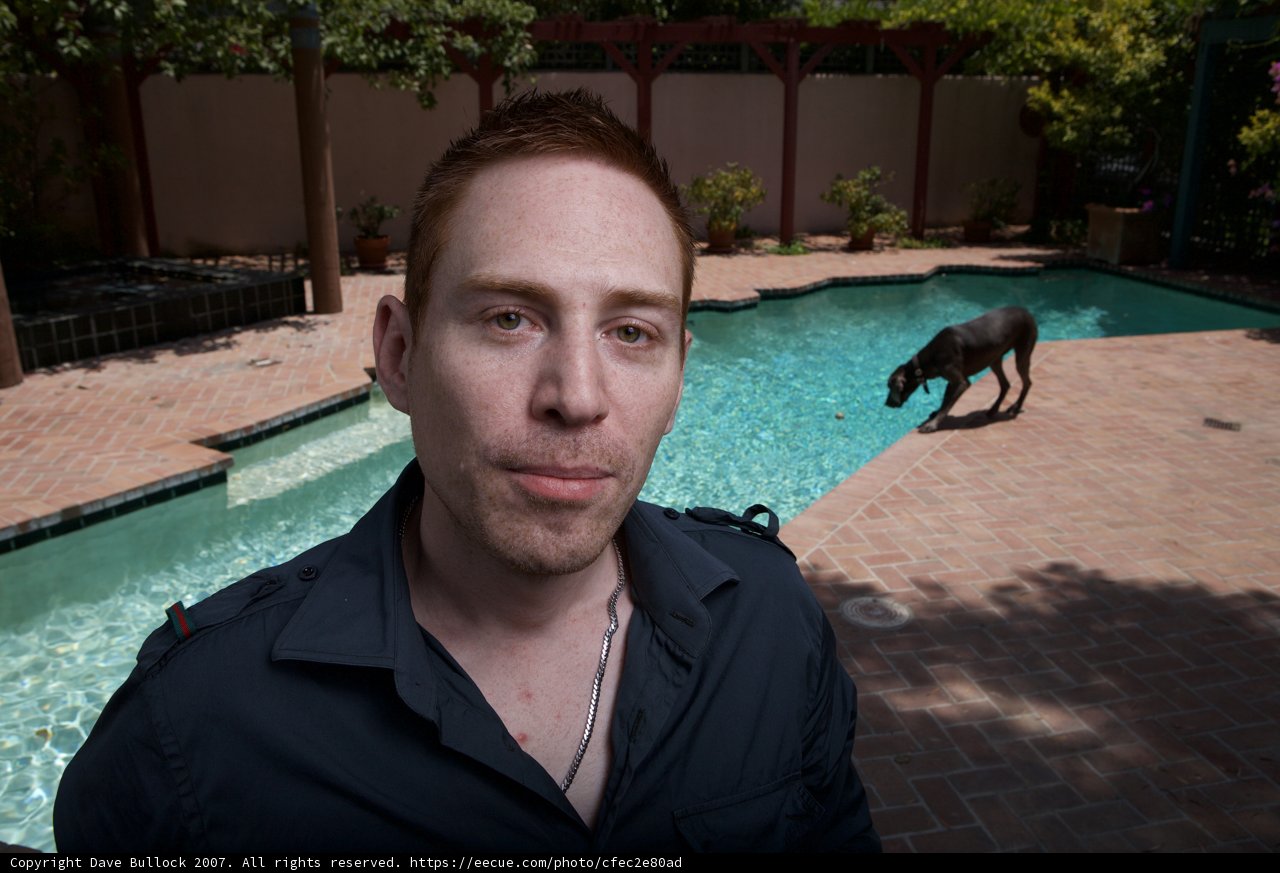 Man and Dog Enjoying a Day at the Pool