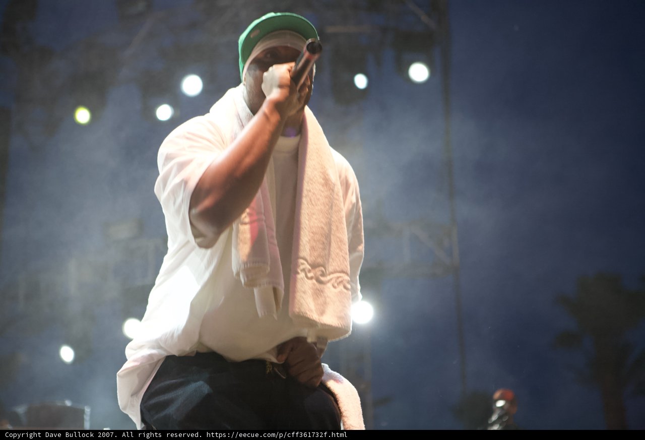 Solo Performer in Green Hat and White Shirt Takes Center Stage