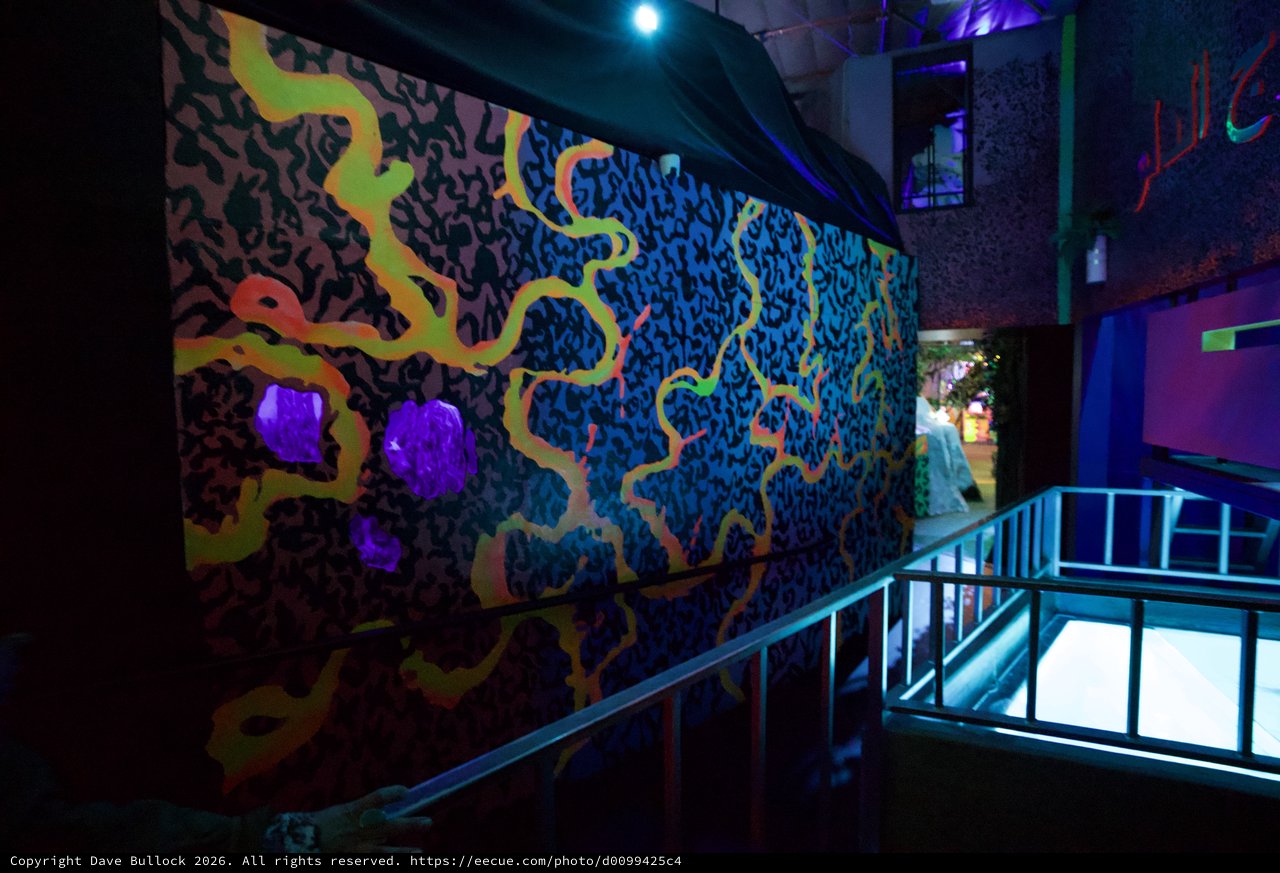 Vibrant UV-Reactive Mural in Contemporary Gallery Space
