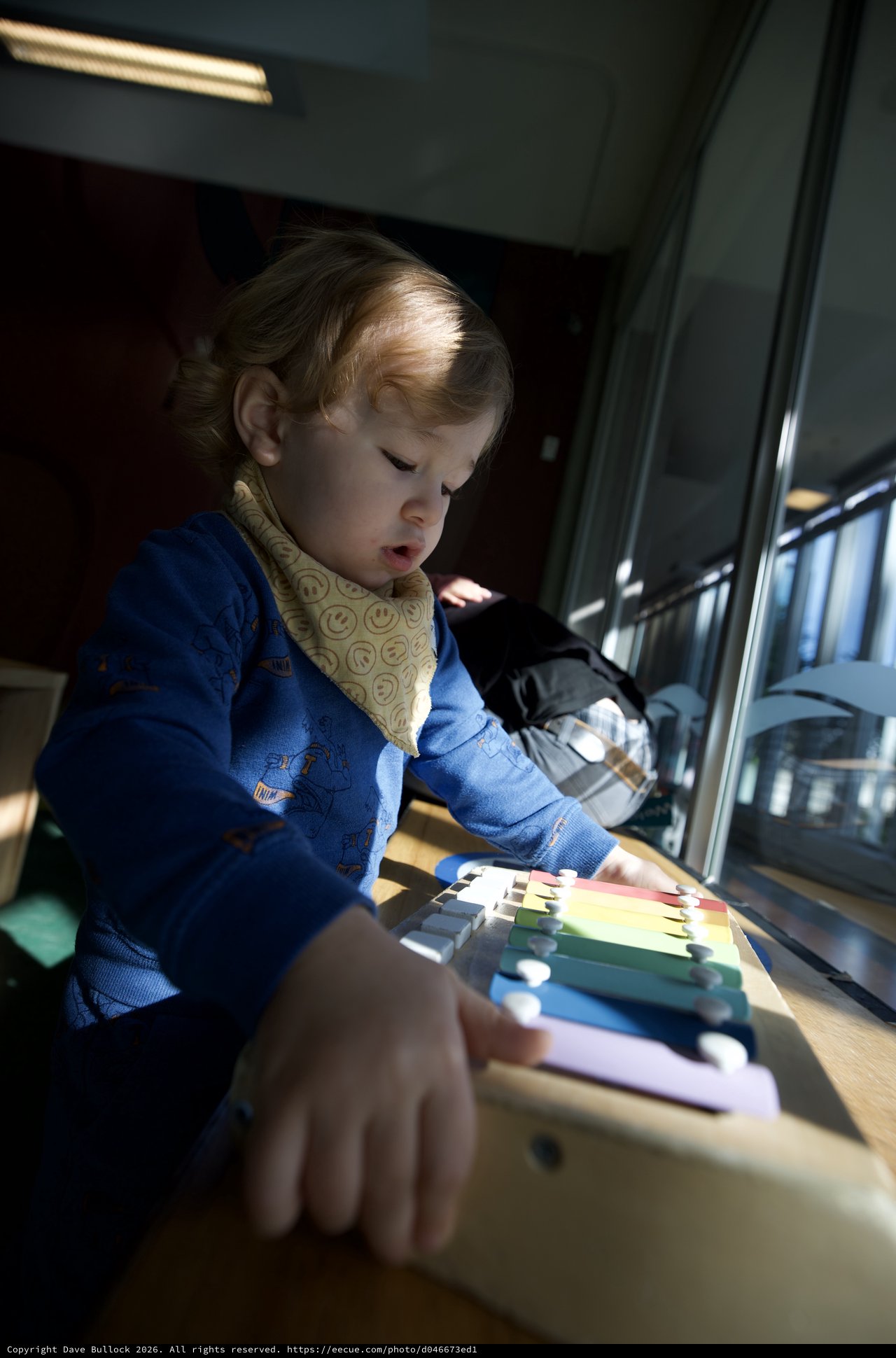 Young Child Exploring Colorful Educational Toy at Home