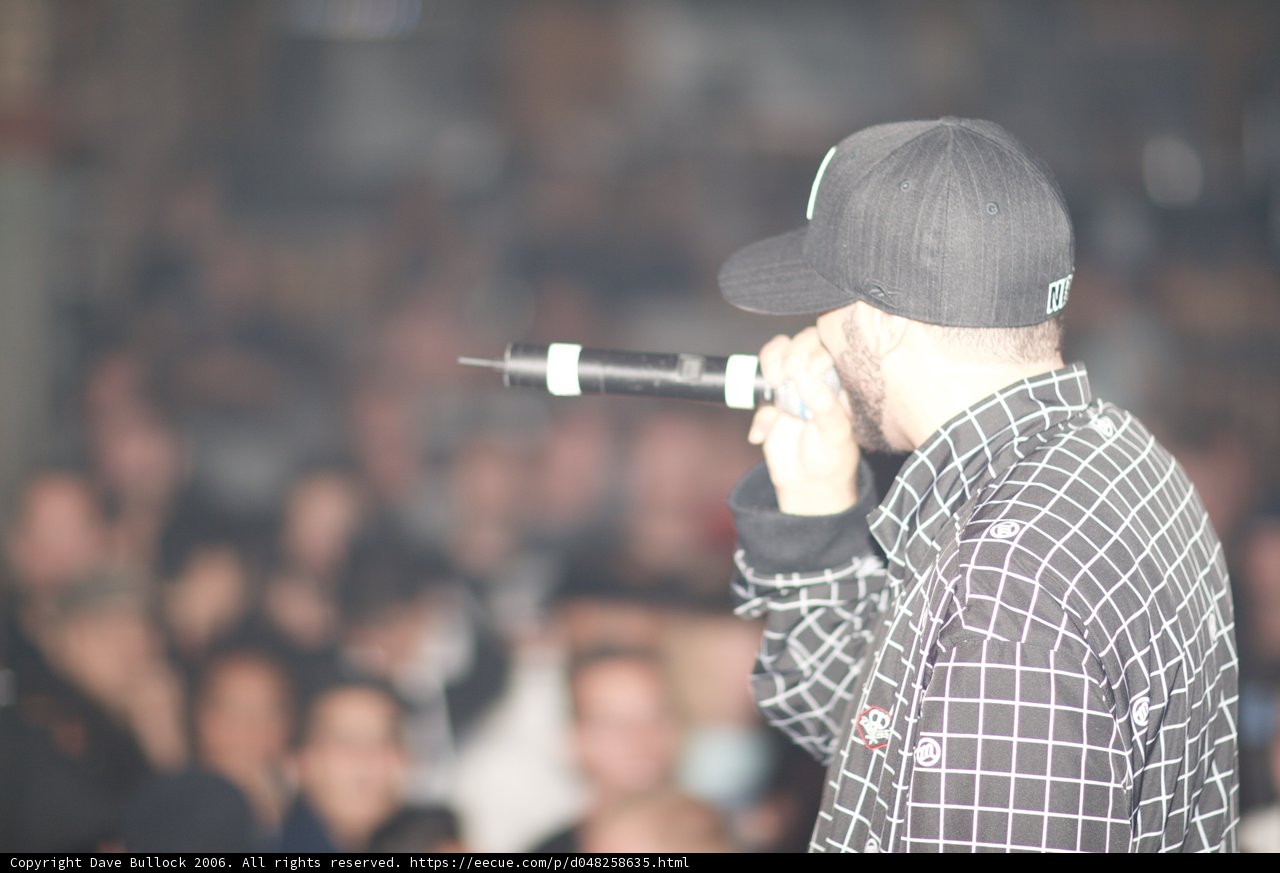 Mic in Hand, Hat on Head