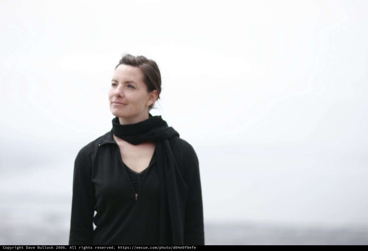 Contemplative Portrait by Misty Coastal Waters