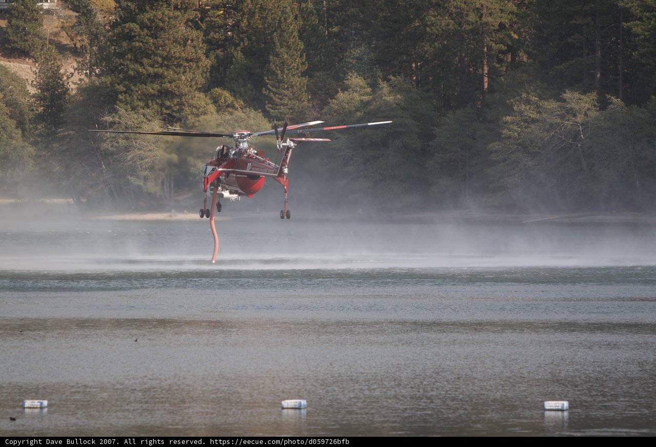 Aerial View of a Helicopter over a Water Body