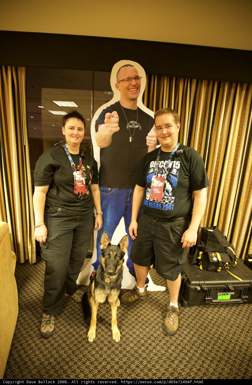 Man, Woman, and Furry Friend Strike a Pose