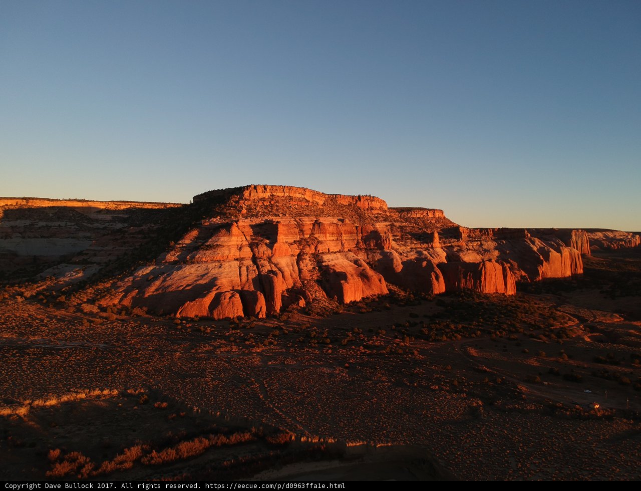 Sun sets over red rock formations