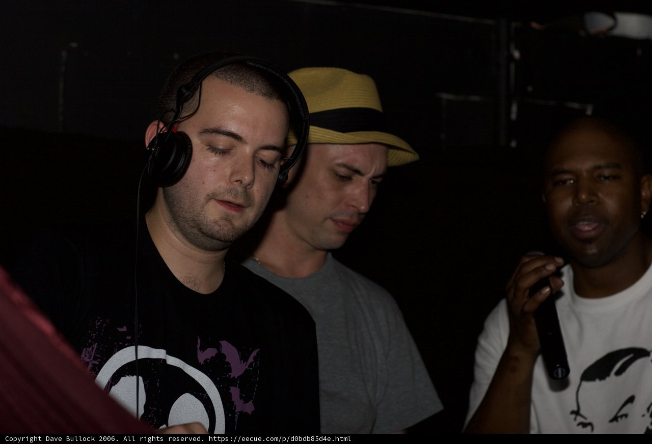 Three Men in Black Headphones and T-Shirts