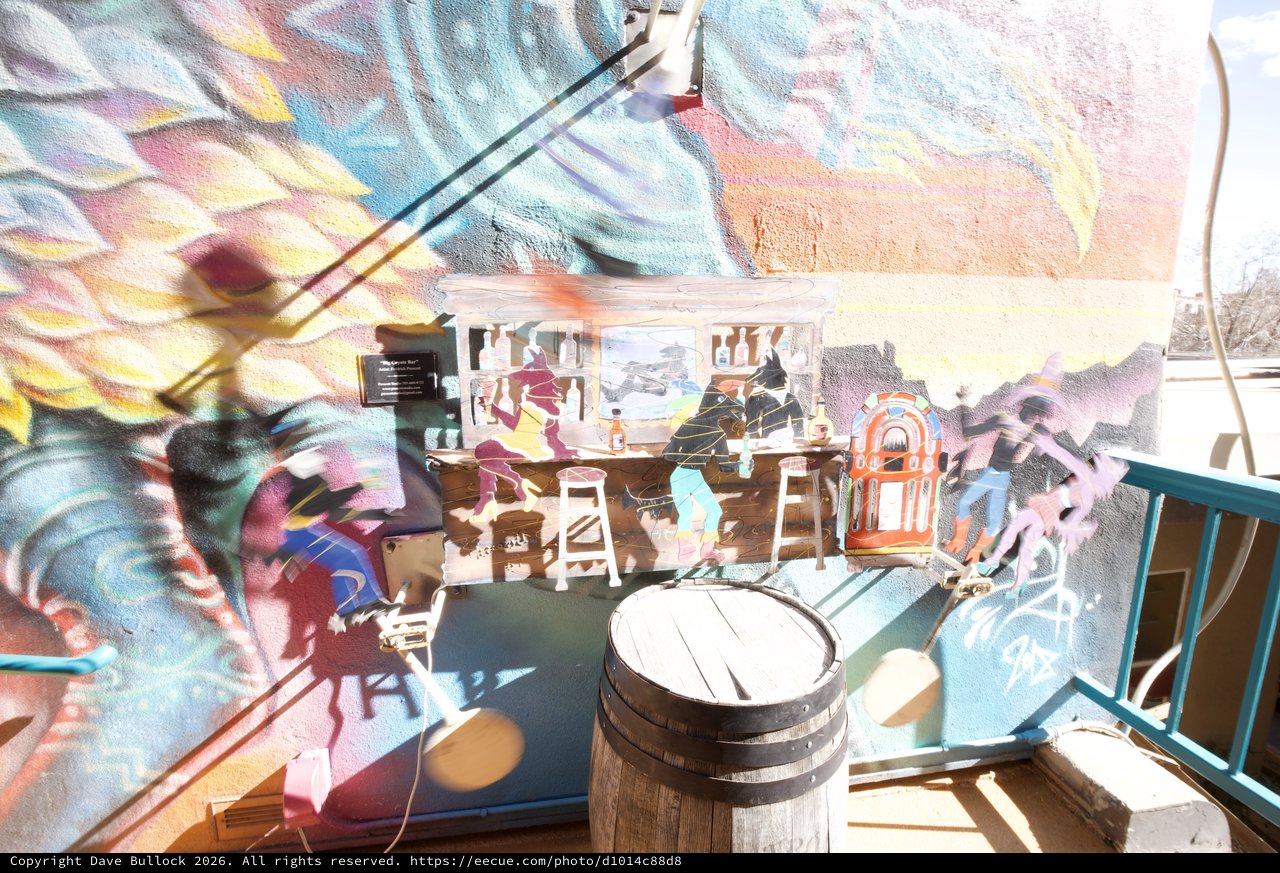Vibrant Mural Reflections in Santa Fe Gallery Window