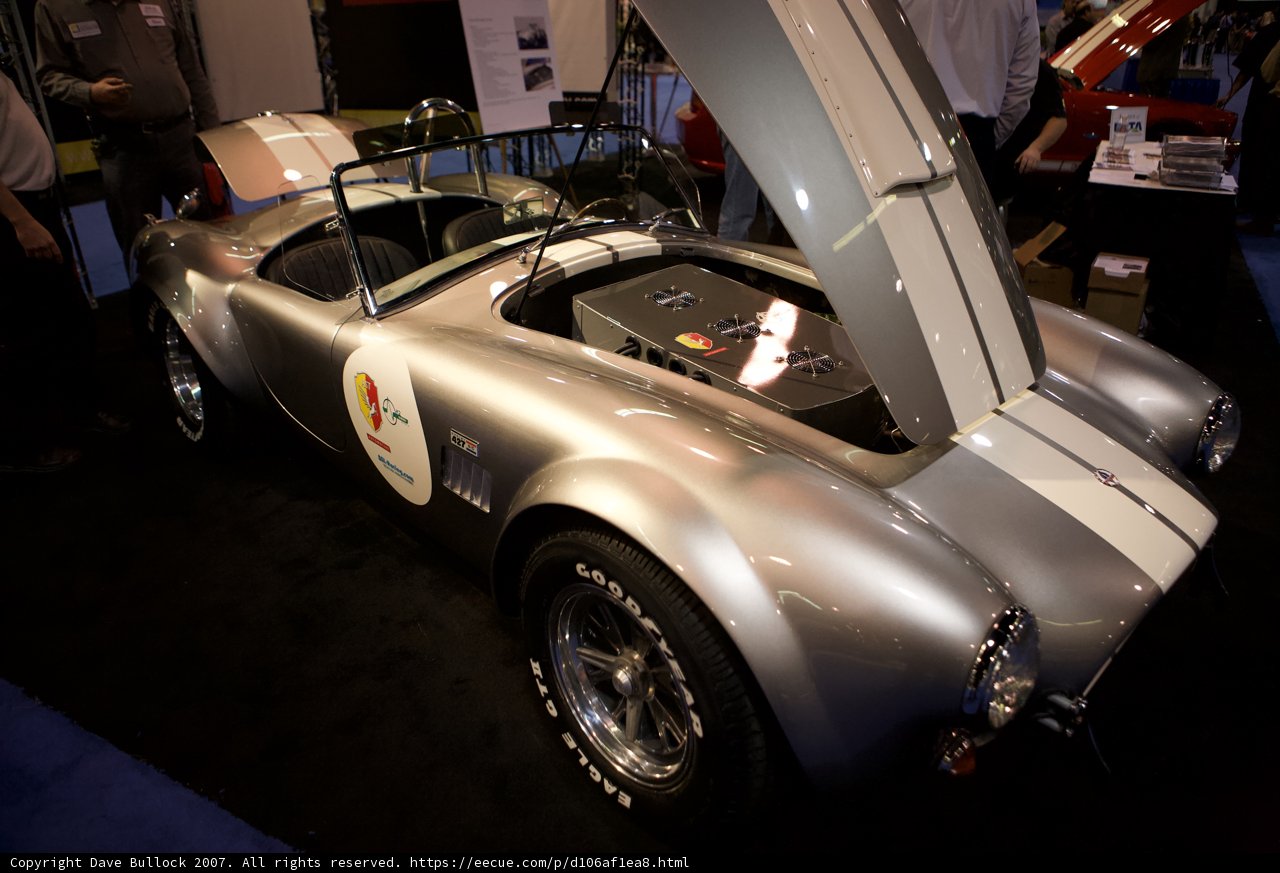 Sleek Silver Sports Car on Display at Car Show