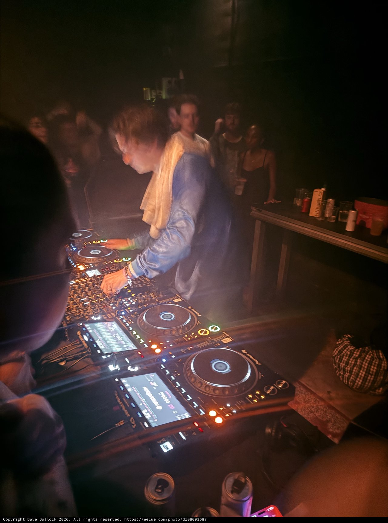 DJ Performance in Atmospheric Club Setting