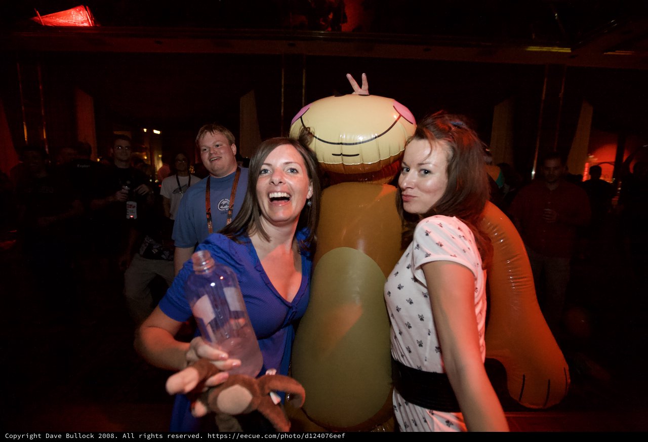 Party Guests Pose with Giant Inflatable Toy
