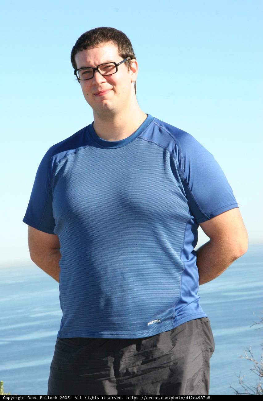 Dave B enjoying the ocean view with his blue shirt and glasses on
