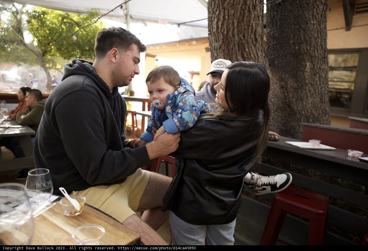 Maternal Whispers and Paternal Holds in Downtown Sonoma