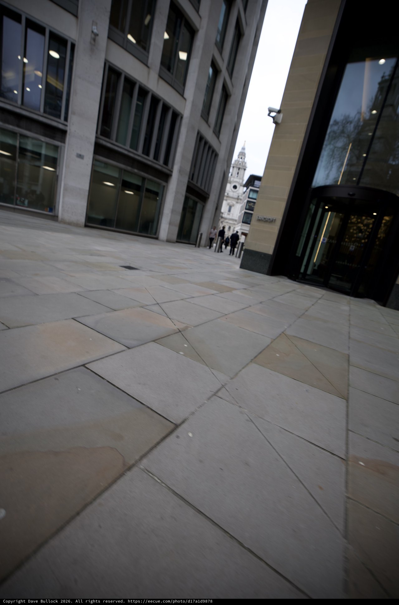 Modern Urban Plaza Leading to Historic Church Tower