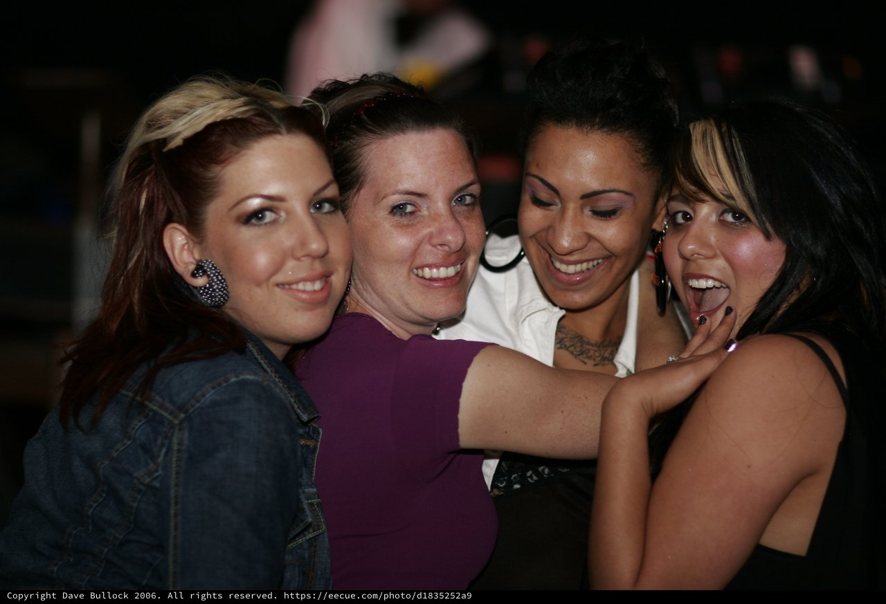 Four Friends Celebrating at a Nightclub in 2006