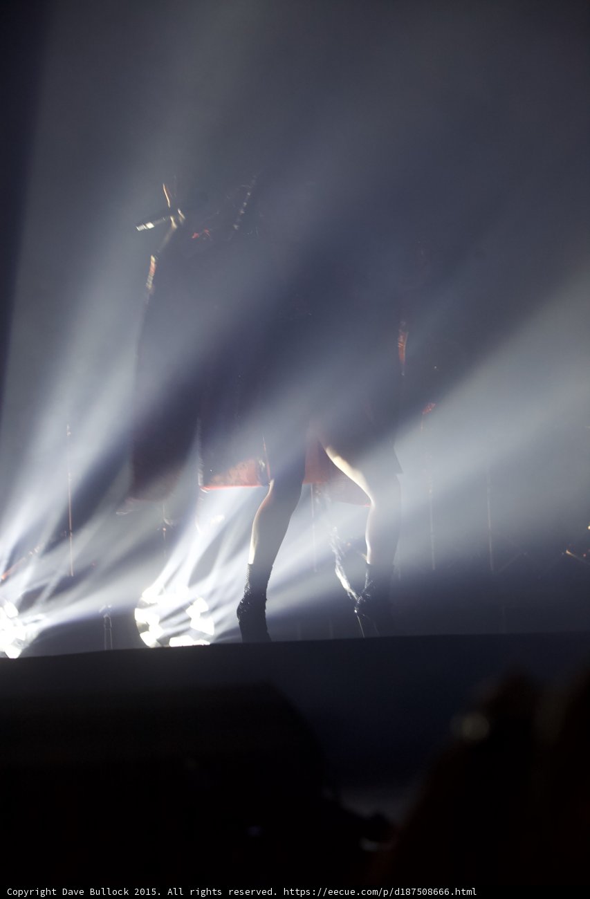 FKA twigs Wide Stage Silhouette White Light Beams Red Kimono Crowd Audience View Dramatic Production