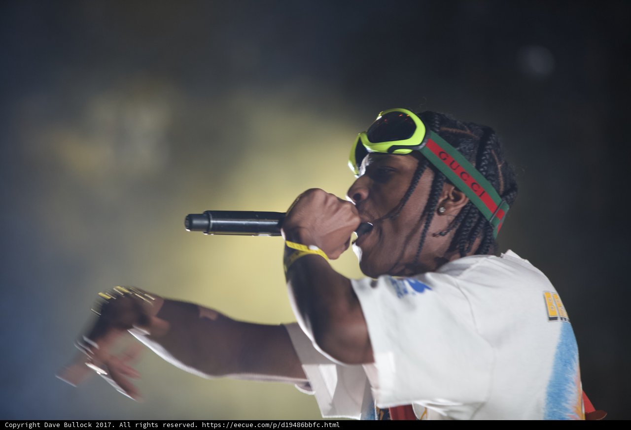 Entertainer with a Microphone and Green Headband