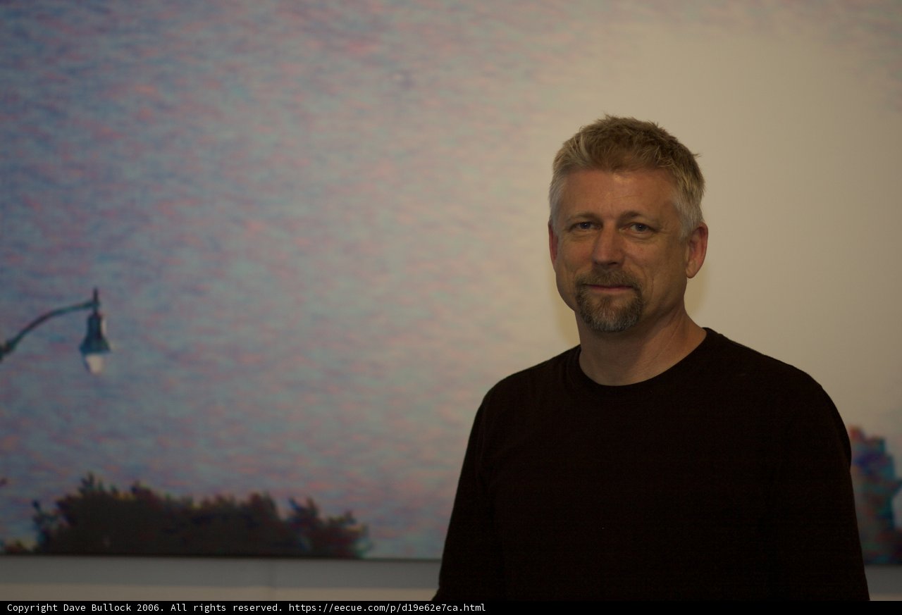 Man Admiring Painting at Gallery