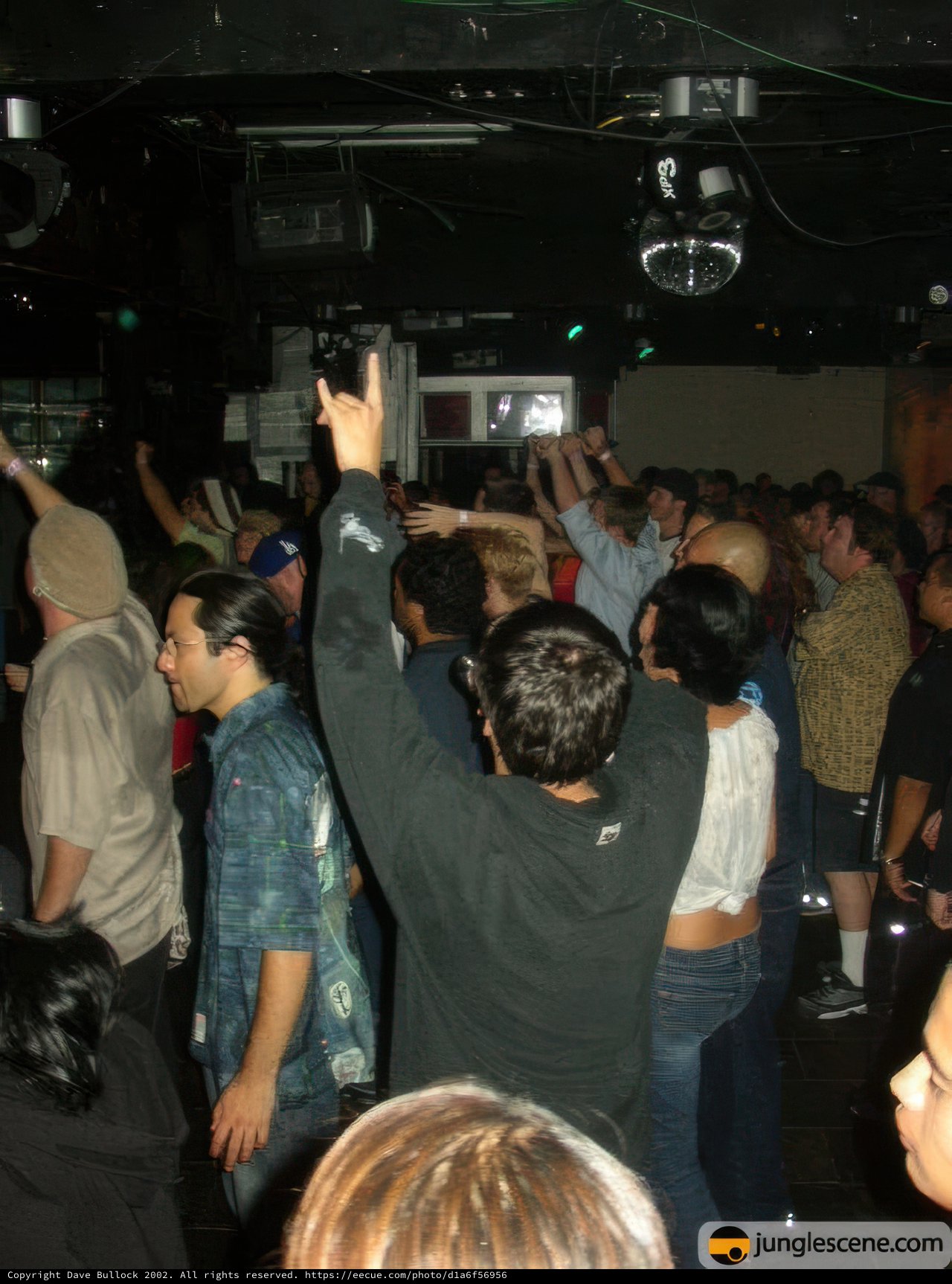 Nightclub Party with Disco Ball and Crowd