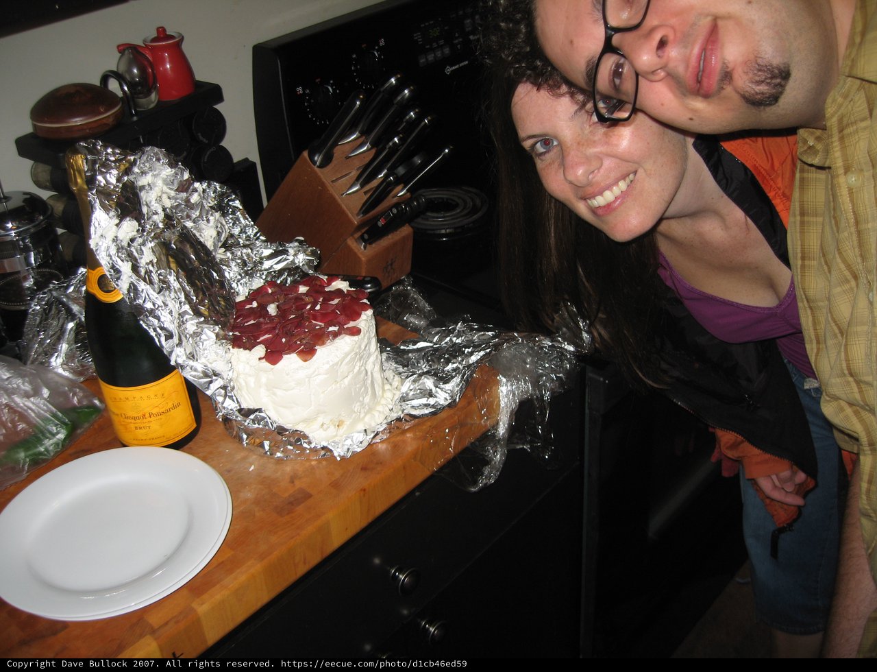 Couple Celebrates Anniversary with Champagne and Cake