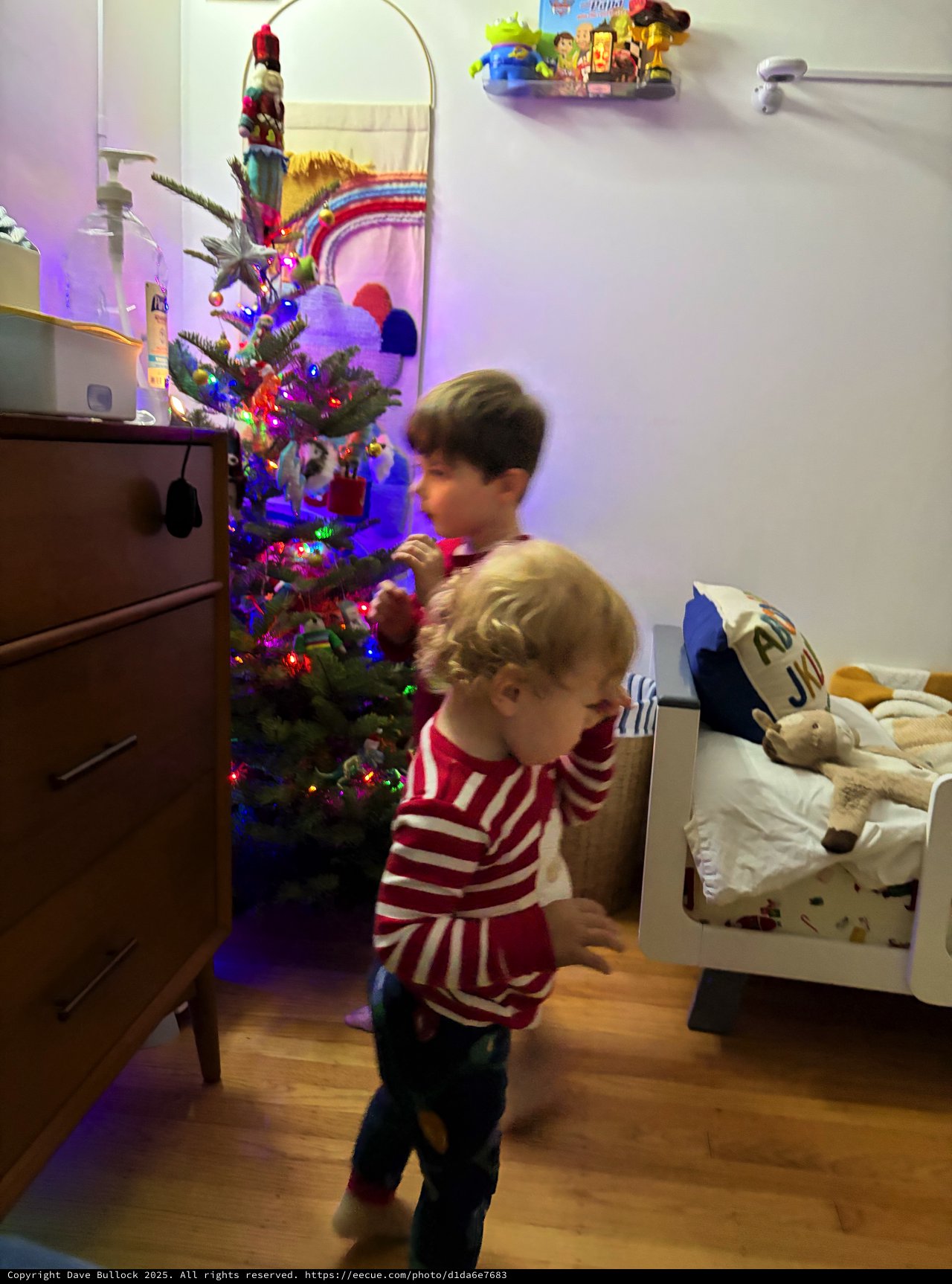 Children Dancing by Christmas Tree in Striped Pajamas
