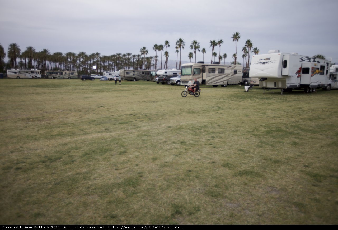 Cyclist Riding Through a Sea of RVs