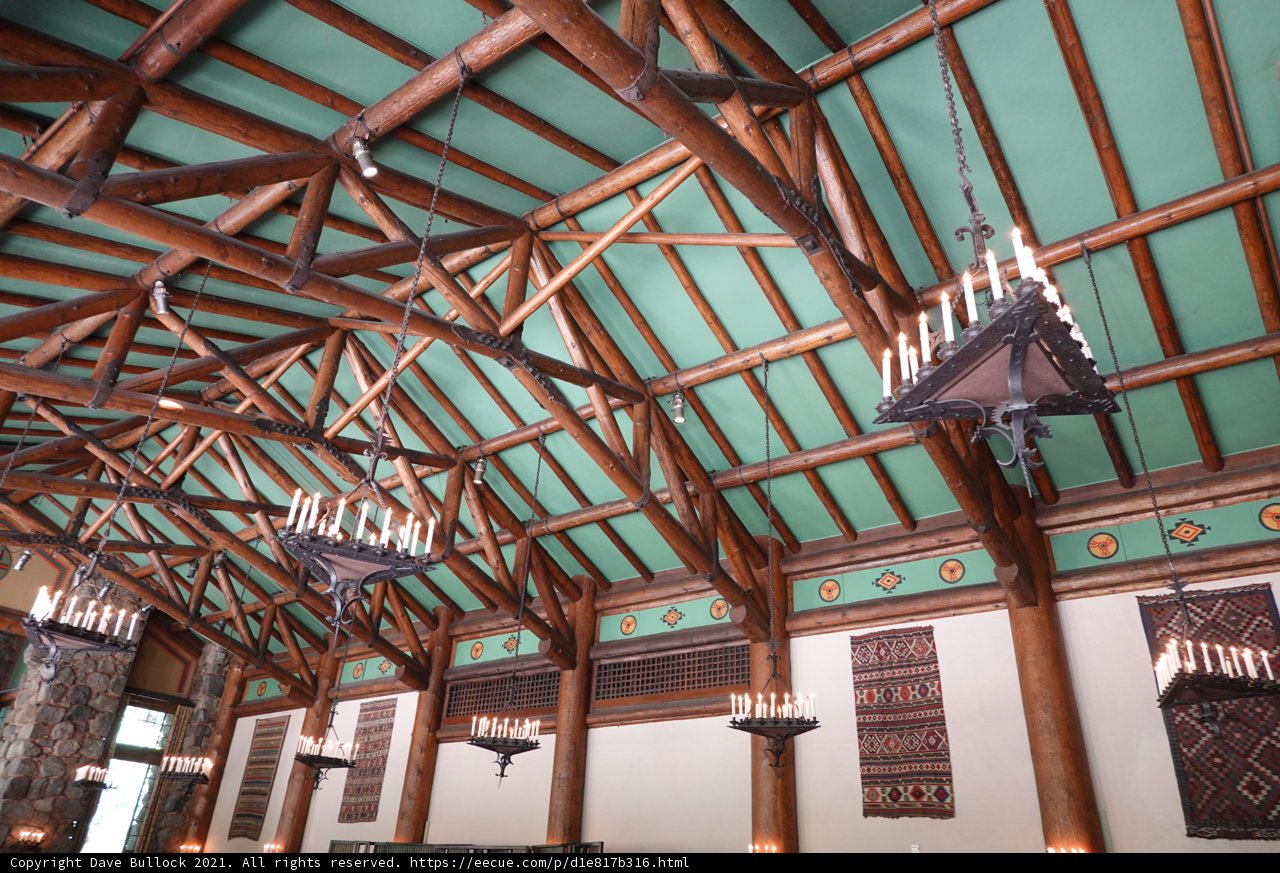 Majestic Chandeliers Hang from a Vaulted Wooden Ceiling