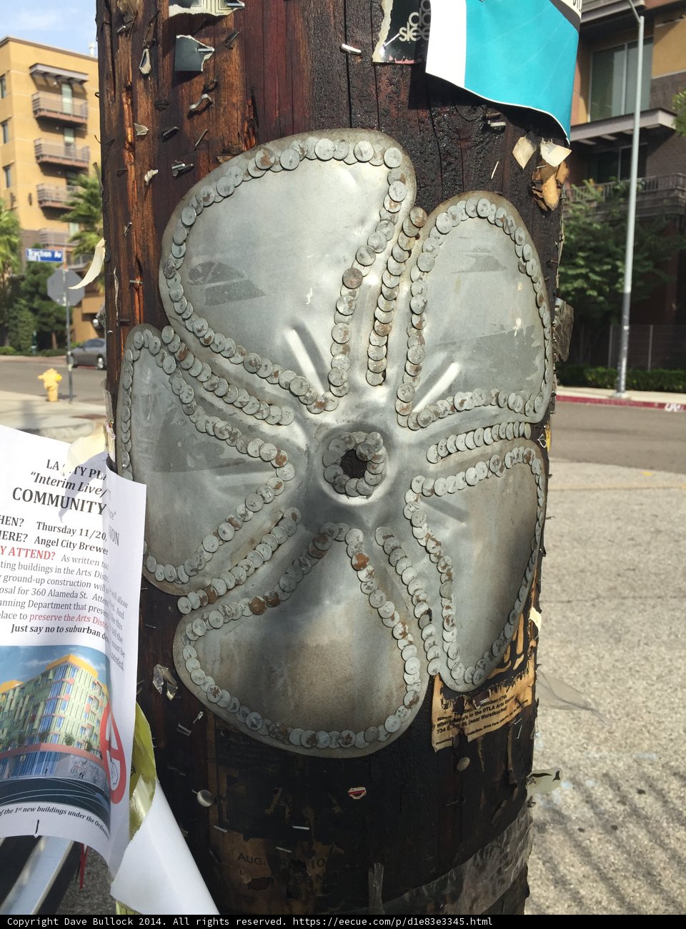 Metal Flower on a Roadside Pole