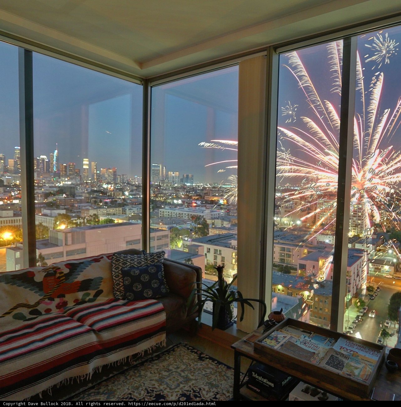 A Breathtaking Cityscape View from a Cozy Living Room