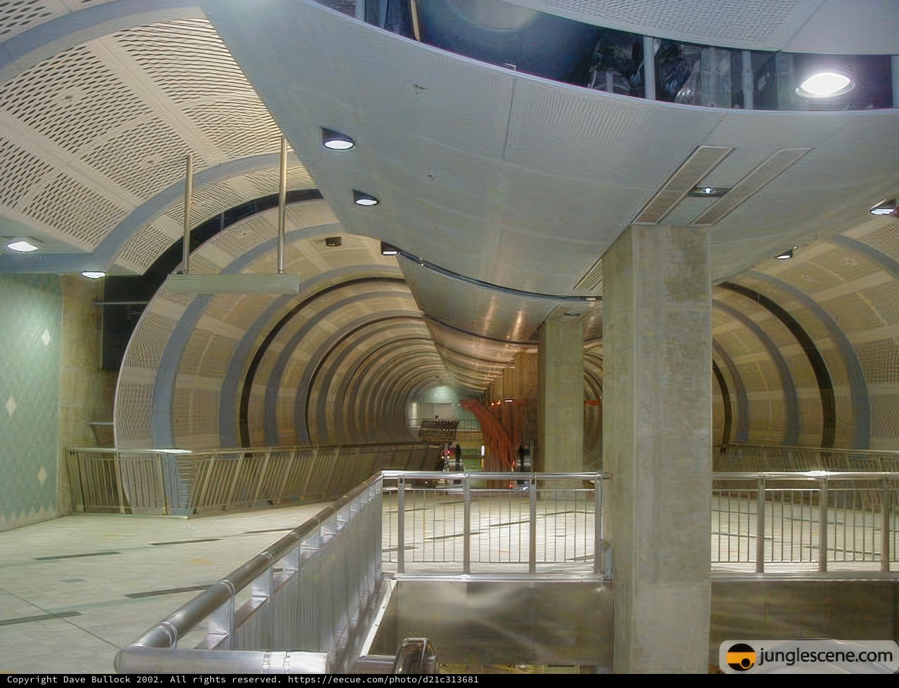 Terminal Corridor with Metal Railings and Staircase