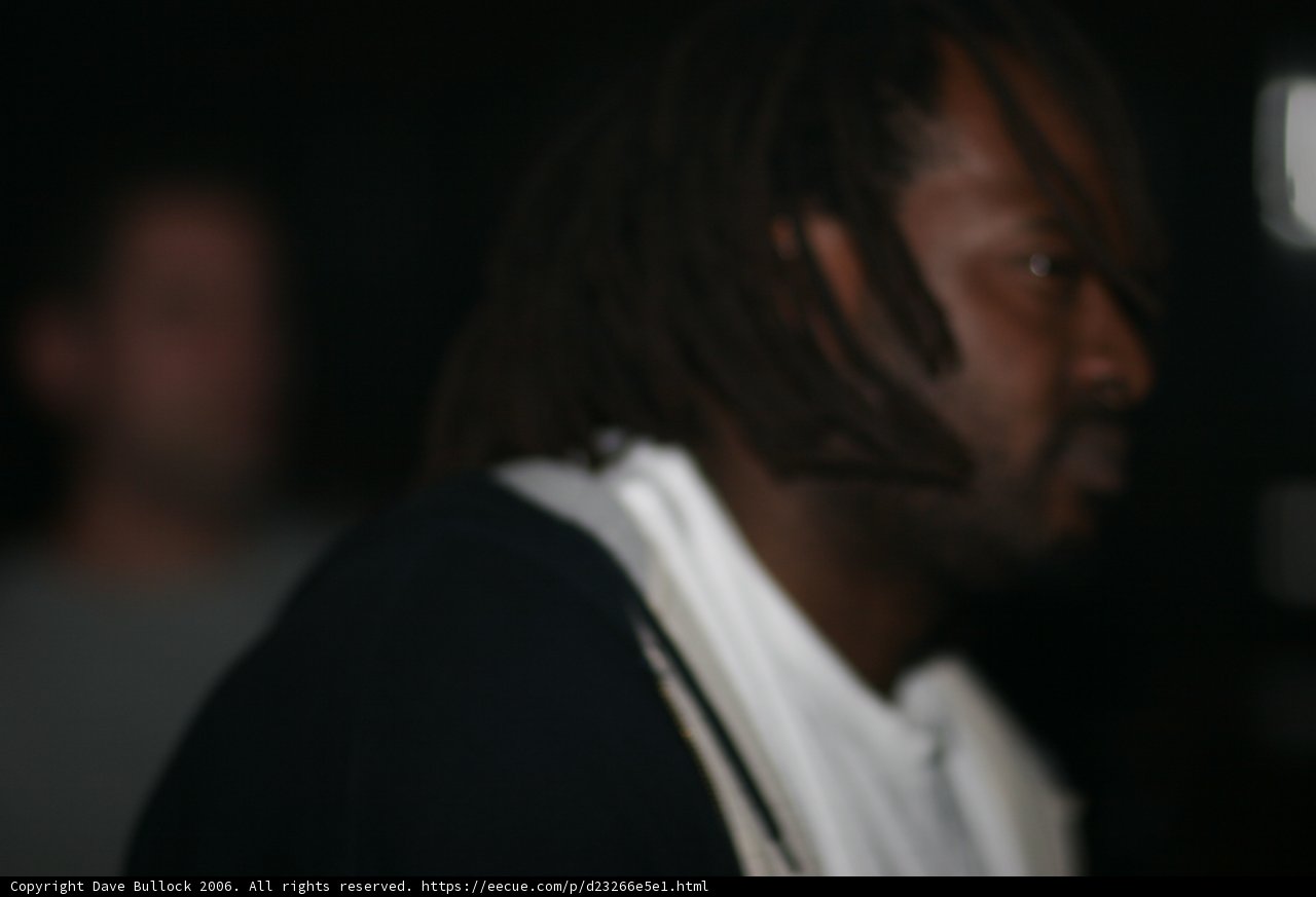 Dreadlocked Man in White Jacket