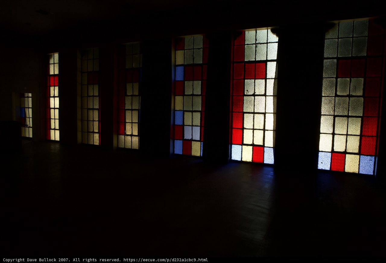 Colorful Stained Glass Windows In a Dark Room