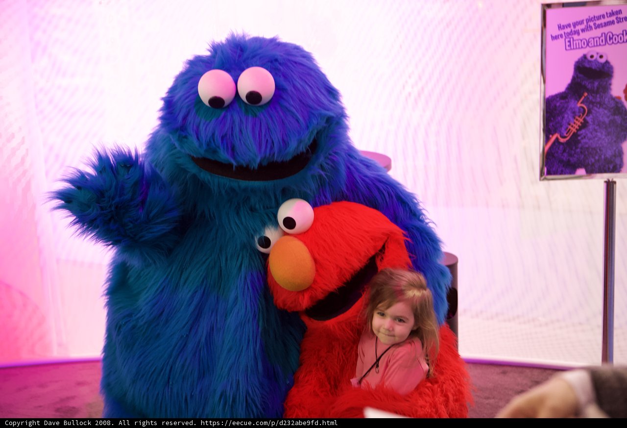 Giant Blue Monster Hugs Petite Girl