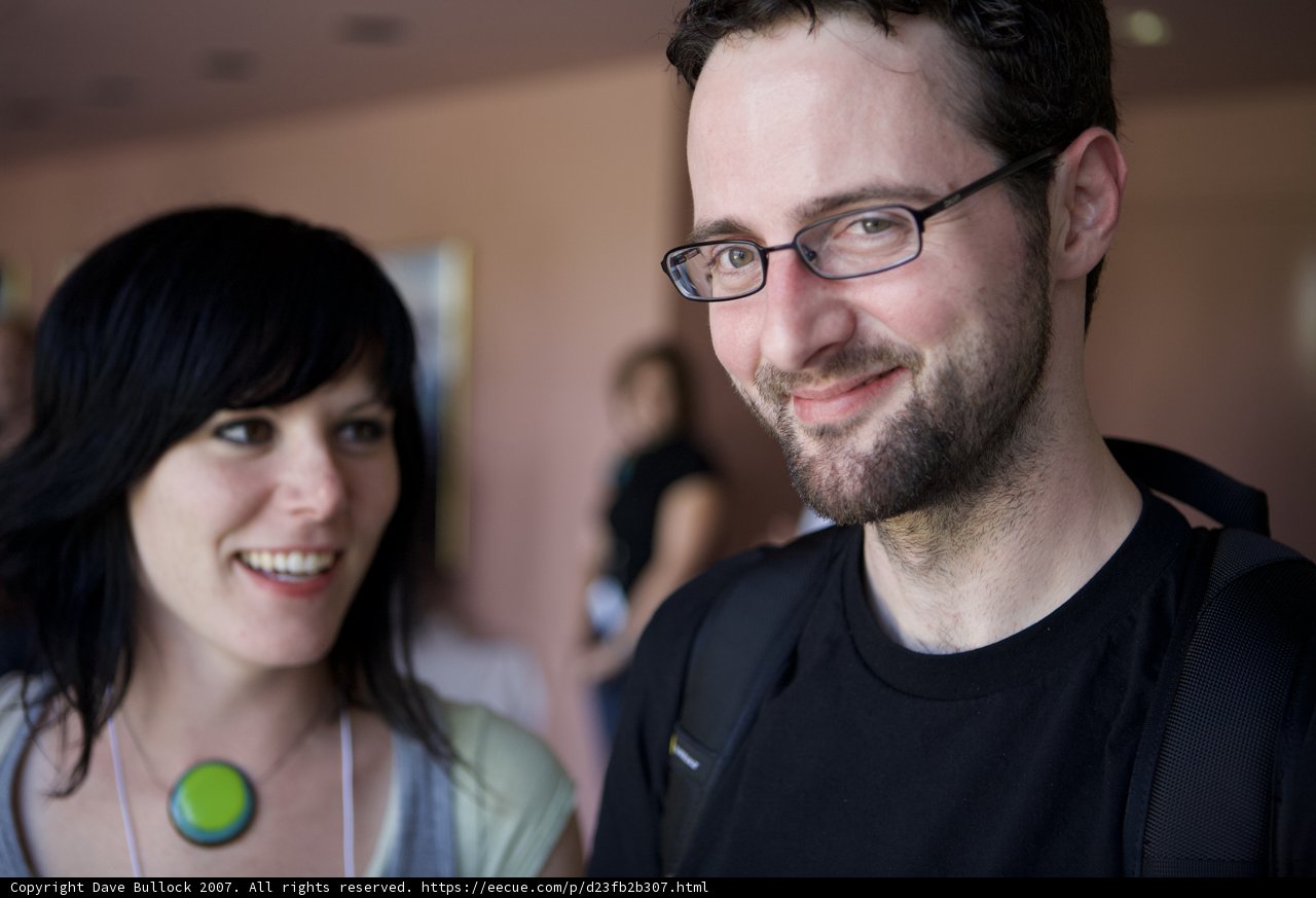 Smiling Duo with Fashionable Glasses and Jewelry