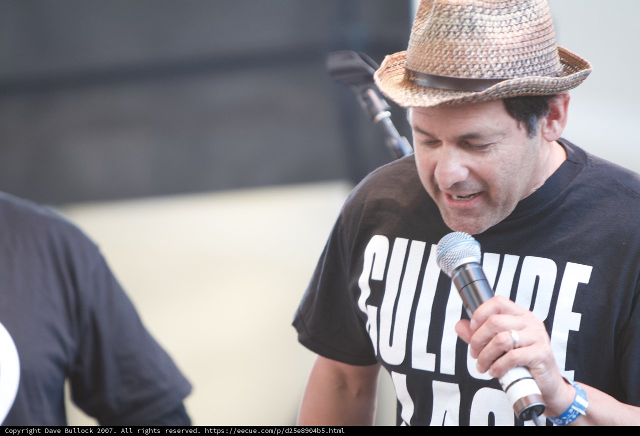 Ozomatli Performer Rocks the Stage in Black Shirt