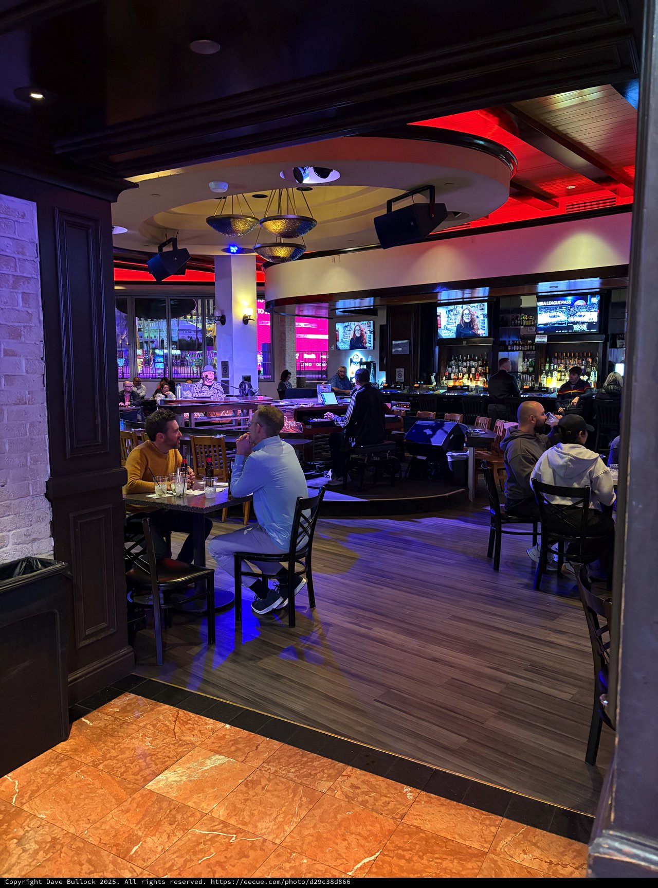 Modern Sports Bar Interior with Vibrant Red Accent Lighting