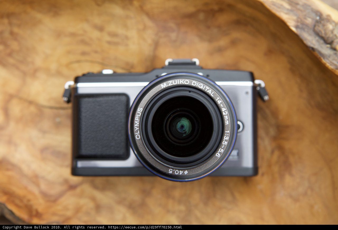 A Close-up of a Camera on Wooden Surface