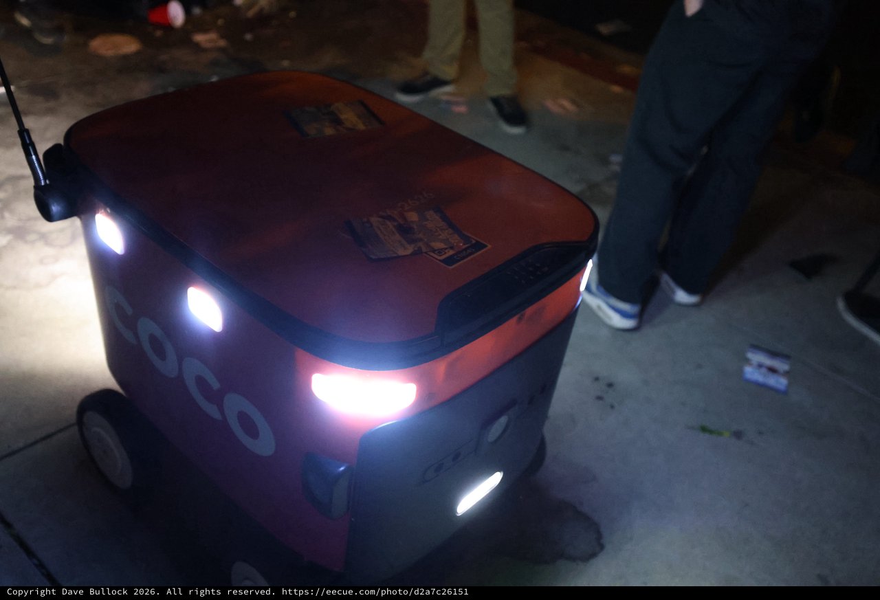 Coco Delivery Robot Navigates Nighttime Festival Crowd