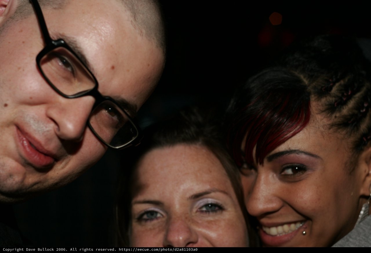Three Friends Squeeze Together for a Close-Up Selfie