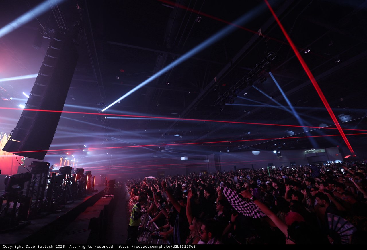 Laser Light Storm Over Pulsing Festival Crowd