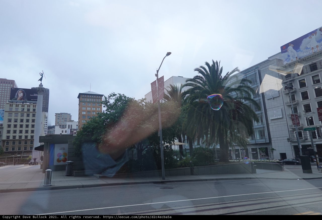 Urban Plaza with Palm Trees and Soap Bubble