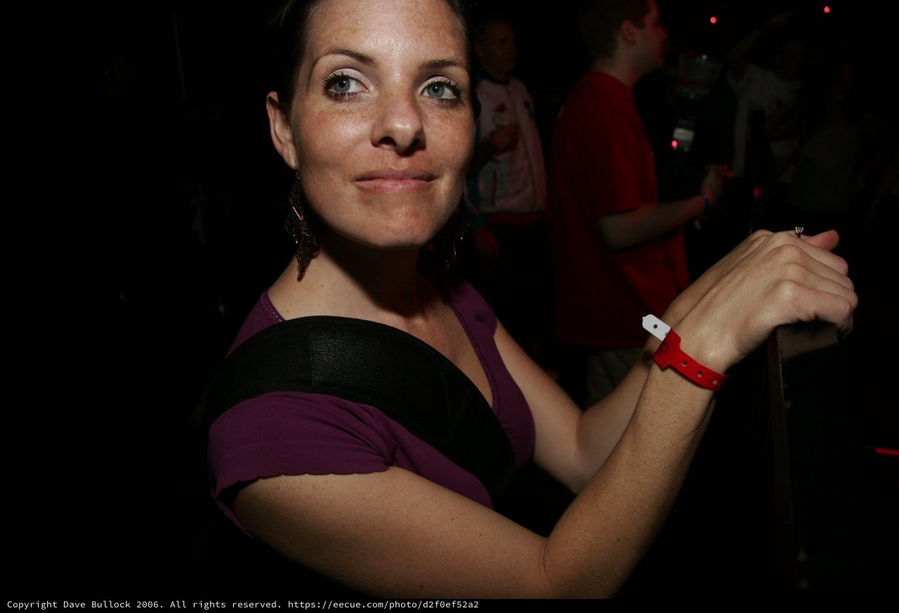 Woman Smiling at Nightclub Event 2006