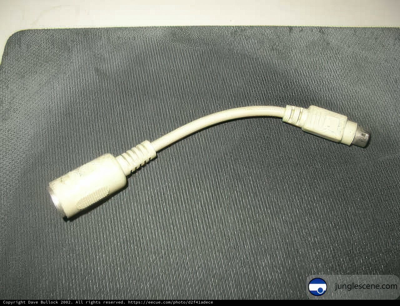 White Cord Connected to Computer