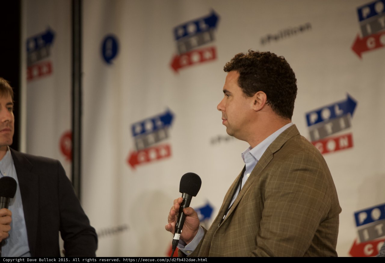 Two Men Engage in Political Discourse at Politicon