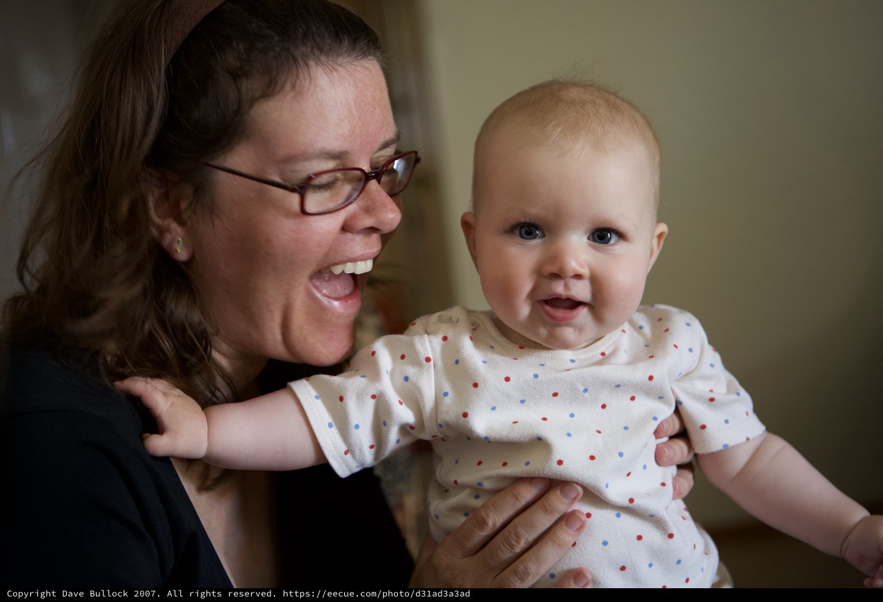 Joyful Mother and Baby Share a Playful Moment
