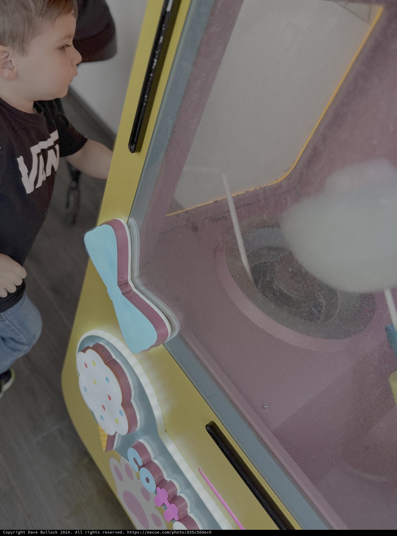Child Watching Sand Art Spiral Display